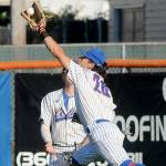 KEITH THORPE/PENINSULA DAILY NEWS
Lefties centerfielder Mauricio Guardado, makes a running catch on a deep fly ball as centerfielder Kyle Becker looks on during Wednesday's game against Kamloops in Port Angeles.
