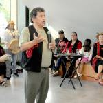 KEITH THORPE/PENINSULA DAILY NEWS
Lower Elwha Klallam artist and storyteller Robert Fernandes, who served as curator of the Field Arts & Events Hall gallery collection of Klallam art works and crafts, speaks about the collection during Thursday night's gallery opening and reception in Port Angeles. The showing has the title "Creations by the Klallam People."