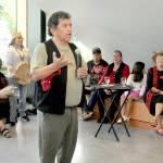 Lower Elwha Klallam artist and storyteller Robert Fernandes, who served as curator of the Field Arts & Events Hall gallery collection of Klallam art works and crafts, speaks about the collection during Thursday nights gallery opening and reception in Port Angeles. The showing has the title Creations by the Klallam People. (KEITH THORPE/PENINSULA DAILY NEWS)