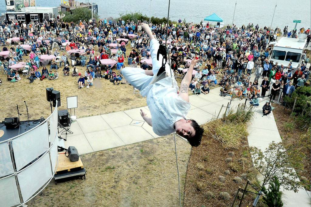 BANDALOOP member Becca Dean dangles above the ground during one of the vertical dance troupes performances at the official grand opening of the Field Arts & Events Hall on Saturday in Port Angeles. (Keith Thorpe/Peninsula Daily News)