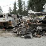 The charred remains of a pair of mobile homes sit on Saturday at the Emerald Mobile Home & RV Park in Port Angeles. (Keith Thorpe/Peninsula Daily News)