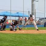 Port Angeles Brock Mayer is hit by a pitch Sunday in the second inning against the Bellingham Bells in a game played Sunday at Civic Field in Port Angeles. (Pierre LaBossiere/Peninsula Daily News)
