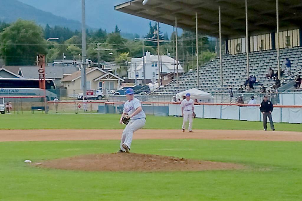 Port Angeles starter Colby Scheuber pitches in the first inning Sunday at Civic Field in Port Angeles against the Bellingham Bells. (Pierre LaBossiere/Peninsula Daily News)