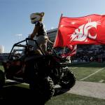 Washington State mascot Butch T. Cougar rides a vehicle before an NCAA college football game between Washington State and Arizona State, Saturday, Nov. 12, 2022, in Pullman. (Young Kwak/The Associated Press)