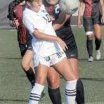KEITH THORPE/PENINSULA DAILY NEWS Peninsulas Maylin Rivera, front, battles for control with Everetts Lucy Soriano-Sanchez as fellow Trojans Shaelyn Gerrodette, left, and Taejah Hardeman watch from the backfield on Saturday in Port Angeles.