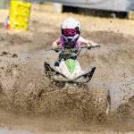 Rebel Lewis, 6, takes her Tau 125 on a run of the mud course during the Jefferson County Fair on Sunday. (Steve Mullensky/for Peninsula Daily News)