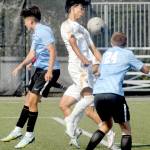 KEITH THORPE/PENINSULA DAILY NEWS Peninsulas Matthew Enriquez, center, tries to settle the ball while surrounded by Pierces Roel Degollado, left, and Payton Lambdin, right, and teammate Don Vaios Dovas, rear, during Saturdays match in Port Angeles.