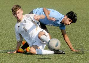 Peninsulas Alfie Tucker front, gets tangled on the pitch with Pierces Manuel Lomeli during Saturdays match at Wally Sigmar Field.