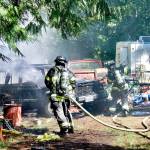 Clallam 2 Fire-Rescue firefighters battle a car fire on Lower Elwha Road.