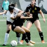 Desiree Dutra, center, fends off the defense of North Idahos Teresa Ledezma while teammate Lauren La Fountain watch on Saturday afternoon in Port Angeles. (Keith Thorpe/Peninsula Daily News)
