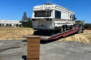 In mid-July, an RV parked partially on public and private property was towed at the request of the City of Sequim after it was deemed abandoned after 18 months parked in one spot. Its one of a handful of RVs and vehicles illegally parked in the City of Sequim as nonprofit agencies seek safe housing options for residents. (Michelle Ridgway)