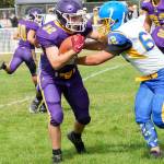 Steve Mullensky/for Peninsula Daily News Quilcenes Mason Iverson, left, fights for yardage during a Sept. 2022 game against Crescent. Iverson led the Rangers in rushing yards last season and returns at fullback for Quilcene.