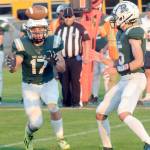 Port Angeles Jason Hawes, left, takes a backfield toss from quarterback Parker Nickerson during Friday nights game against Anacortes at Port Angeles Civic Field. (Keith Thorpe/Peninsula Daily News)