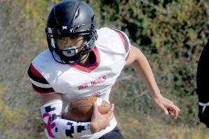 Neah Bays Jodell Wimberly carries the ball during a game last fall against Crescent. Wimberly is the leading offensive skill position player returning from last seasons Class 1B state runner-up Red Devils. (Keith Thorpe/Peninsula Daily News)