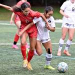 Peninsula College's Briana-Jean Tanaka (2) battles with Lower Columbia's Nataija Blaylock (21) for the ball in an NWAC Friendly held Tuesday in Tukwila. In the background is Peninsula College's Anna Petty. Tanaka and Petty each scored two goals as Peninsula won 8-1. (Rick Ross/Peninsula College)