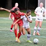 Peninsula Colleges Briana-Jean Tanaka (2) battles with Lower Columbias Nataija Blaylock (21) for the ball in an NWAC Friendly held Tuesday in Tukwila. In the background is Peninsula Colleges Anna Petty. Tanaka and Petty each scored two goals as Peninsula won 8-1. (Rick Ross/Peninsula College)