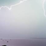 Lightning streaks across Port Townsend Bay on Tuesday afternoon. (Steve Mullensky/for Peninsula Daily News)