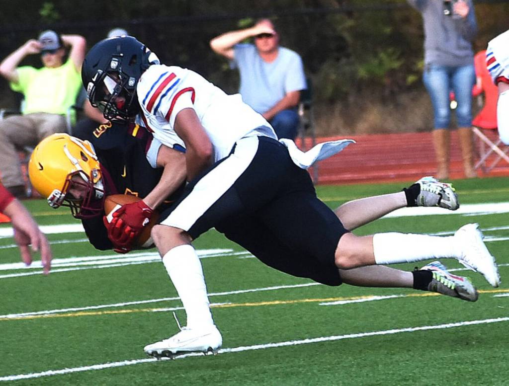 East Jefferson's Cash Holmes made a hard tackle against Kingston in Kingston on Friday night. (Nicholas Zeller-Singh/Kitsap News Group)