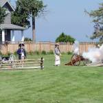 A canon is fired during a reenactment of a Revolutionary War skirmish during the Northwest Colonial Festival at the George Washington Inn on Saturday near Agnew. The event, hosted by the inn and sponsored by the Olympic Peninsula Visitors Bureau, the City of Sequim and Rocket Transportation, featured a variety of period displays and interpretations of life in the Colonial Era of the early United States. (Keith Thorpe/Peninsula Daily News)