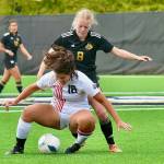 Peninsula College's Anna Petty (8) battles with Everett's Miah Manibusan (18) over possession of the ball in Wednesday's match at Wally Sigmar Field. Petty had two goals and an assist in an 11-0 Peninsula victory. (Jay Cline/Peninsula College)