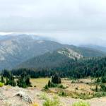 Small plumes of smoke rise from the Eagle Point Fire, as seen from the Hurricane Hill Trail, as rain moves into the area. (Olympic National Park)