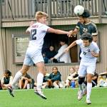 Peninsula Colleges Jem Ndja (22) heads the ball upfield while defended by Everetts Reid Schaeffer, left, and Luis Carillo during the Pirates 3-2 home loss Wednesday at Wally Sigmar Field. (Jay Cline/Peninsula College Athletics)