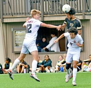 Peninsula Colleges Jem Ndja (22) heads the ball upfield while defended by Everetts Reid Schaeffer, left, and Luis Carillo during the Pirates 3-2 home loss Wednesday at Wally Sigmar Field. (Jay Cline/Peninsula College Athletics)
