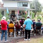 Author M.B. Thurman reads from her debut novel, Summoned, in front of the Miller Tree Inn, aka the Cullen House, during a pre-Forever Twilight in Forks event on Tuesday. M.B. (Mary Beth) and her husband Trent own the Inn. This weeks FTF Festival will also feature other authors at several other venues. (Christi Baron/Olympic Peninsula News Group)