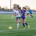 Emily Matthiessen (2)/Olympic Peninsula News Group
Port Angeles Izzy Felton, left, and Sequims Mikiah Winter jostle for possession of the ball along the sideline during the first half of the Wolves 2-1 Rainshadow Rumble girls soccer victory.