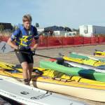 Ian Mackie of Gig Harbor prepares to launch his kayak from Pebble Beach as an iron man competitor during the 2022 Big Hurt in Port Angeles. (Keith Thorpe/Peninsula Daily News)