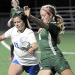 KEITH THORPE/PENINSULA DAILY NEWS
Port Angeles' Becca Manson, right, fights for control with Olympic's Emiko Carrier-Berndt on Thursday night at Peninsula College.