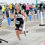 KEITH THORPE/PENINSULA DAILY NEWS Jennifer Higgins of Bozeman, Mont., crosses the line as top womans racer in the ironman category of Saturdays Big Hurt in Port Angeles.