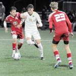 Peninsulas Nil Grau, center, fights off Skagit ValleysFernando Velazquez as defender Mark Bakker waits for the advance on Wednesday night at Peninsulas Wally Sigmar Field. (Keith Thorpe/Peninsula Daily News)