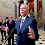 House Speaker Kevin McCarthy, R-Calif., joined by Rep. August Pfluger, R-Texas, right, and other GOP members, talks to reporters just after voting to advance appropriations bills on the House floor at the Capitol in Washington on Tuesday night. McCarthy is digging in on his refusal to take up Senate legislation designed to keep the federal government fully running beyond midnight Saturday. (J. Scott Applewhite/The Associated Press, File)