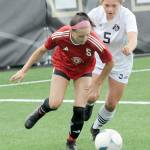 KEITH THORPE/PENINSULA DAILY NEWS Peninsulas Taya Bohenko, right, chases down Skagit Valleys Renee Wargo during Wednesdays match at Peninsula College.