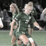 KEITH THORPE/PENINSULA DAILY NEWS
Port Angeles Paige Mason, center, slips past Bremerton's Melanie Unrich at midfieldd during Tuesday's match at Peninsula College.