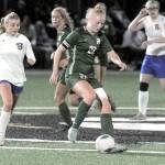 Port Angeles Paige Mason, center, slips past Bremertons Melanie Unrich at midfieldd during Tuesdays match at Peninsula College. (Keith Thorpe/Peninsula Daily News)