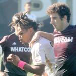 KEITH THORPE/PENINSULA DAILY NEWS
Peninsula's Abdurahim Leigh, center, squeezes between Whatcom's Francesco Plando, right, and Koren Collier during Saturday's match at Peninsula College.
