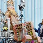Artist Carol Rawshanna Williams looks up at her newly unveiled installation, Dragon Trash Guardian, at the Jefferson County Transfer Station on Monday evening. As part of the countys Artist in Residence and Education program, Williams seeks to connect people with art, upcycling and one another. (Diane Urbani de la Paz/For Peninsula Daily News)