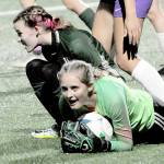 KEITH THORPE/PENINSULA DAILY NEWS
Sequim goalkeeper Kalli Grove clutches the ball after withstanding a shot by Port Angeles' Pyper Alton, lower left, and is assisted by teammate Amara Gonzalez, center, on Tuesday in Port Angeles.