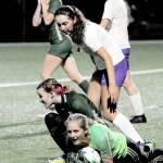 Sequim goalkeeper Kalli Grove clutches the ball after withstanding a Port Angeles shot Tuesday night at Wally Sigmar Field. In on the play are Port Angeles Pyper Alton, lower left, and Sequims Amara Gonzalez, center, on Tuesday in Port Angeles. (Keith Thorpe/Peninsula Daily News)