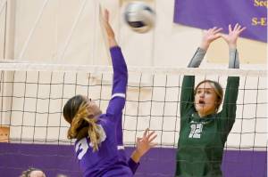 Sequims Arianna Stovall (33) looks to spike the ball as Port Angeles Natalie Tenneson (12) looks to block. Also looking on are Port Angeles Josephine Edgington (3) and Paige Pangaro (13). (Michael Dashiell/Olympic Peninsula News Group)