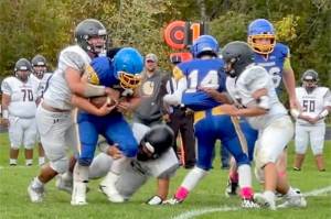 Crescents Tommy Leonard runs the ball Tuesday against Lummi with blocking help from teammate Dominiq Sprague (14) in Joyce. Crescent won 58-0. (Crescent football)