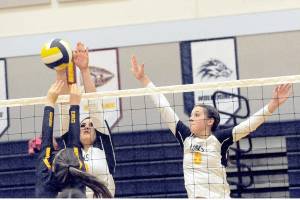 Spartans Kaidance Rigby (left) and Chloe Gaydeski compete at the net with Ilwaco's Alycia Figueroa Thursday evening in the Spartan Gym where Forks defeated the Fisherman 25 to 18, 25 to 17 and 25 to 13 in this league contest.  Photo by Lonnie Archibald.