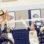 Spartans Kaidance Rigby (left) and Chloe Gaydeski compete at the net with Ilwacos Alycia Figueroa Thursday evening in the Spartan Gym where Forks defeated the Fisherman 25 to 18, 25 to 17 and 25 to 13 in this league contest. Photo by Lonnie Archibald.