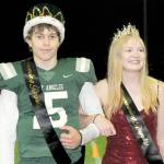 Port Angeles High School senior homecoming royalty King Parker Nickerson and Queen Paige Mason stand before an admiring crowd on Friday at halftime of the schools football game against Bainbridge at Port Angeles Civic Field. (Keith Thorpe/Peninsula Daily News)