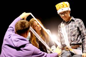Sequim High School Homecoming Queen Taryn Johnson, left, receives a sash at Friday nights football game while king Sage Younger looks on. Sequim shut out North Mason 36-0. (Michael Dashiell/Olympic Peninsula News Group)