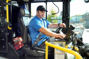 Clallam Transit driver Dante Ruiz prepares his bus for the 30 Route to Sequim on Wednesday at The Gateway transit center in Port Angeles. (Keith Thorpe/Peninsula Daily News)