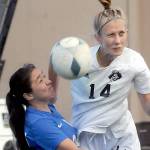 Peninsulas Hannah Wagner deflects a header intended for Edmonds Jennifer Wall Delamora during Wednesdays match at Wally Sigmar Field. (Keith Thorpe/Peninsula Daily News)