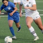 KEITH THORPE/PENINSULA DAILY NEWS
Peninsula's Lauren La Fountain, right, passes past Edmonds' Jennifer Walle Delamora on Wednesday in Port Angeles.